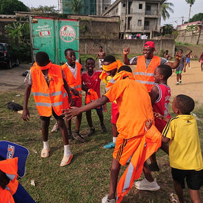 Children in orange vests at Afidi free summer camp activities in Cameroon, Central Africa