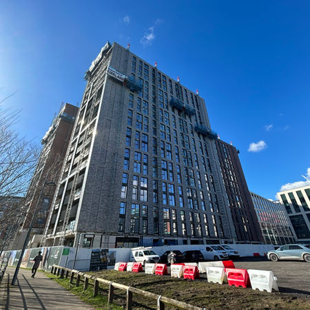 Whitehall Riverside Leeds development and aluminium balustrades against a blue sky during construction