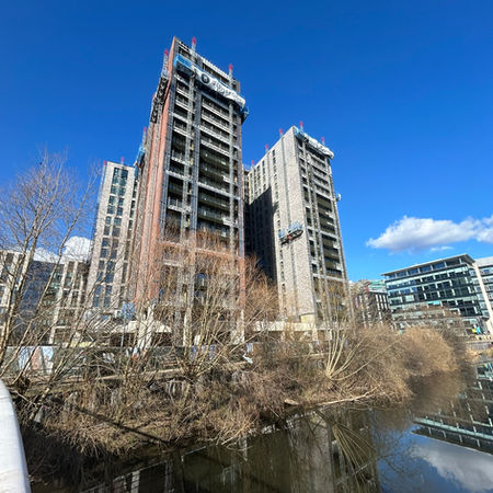 Whitehall Riverside Leeds development and aluminium balustrades against a blue sky during construction