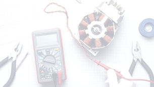 Close-up of 12-wire alternator coil terminals arranged for polarity testing