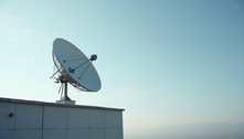 Starlink dish installed on rooftop with clear sky
