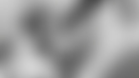 Close-up of a chrome puller tool extracting a bearing