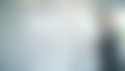 Comparison of business model and business plan diagrams on a whiteboard