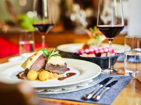 a plate has steak on it and well presented