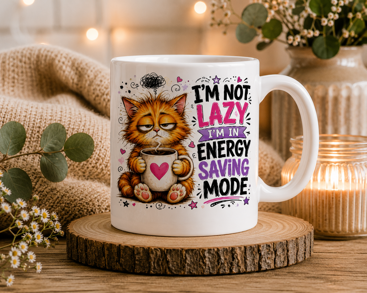 Funny ceramic mug featuring a sleepy orange cat holding a coffee mug with the quote "I'm Not Lazy, I'm in Energy Saving Mode.