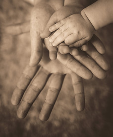 person holding baby's hand_edited.jpg