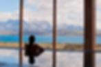 Gazing out from the pool at Tierra Patagonia, one can admire the stunning mountains overlooking the tranquil lake.