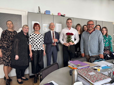 Teachers of Tallinn French Lyceum gathered in the teachers’ room in 2025, smiling and celebrating Martin Filippov’s birthday with warm wishes