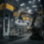 Robotic arm with car body near hydraulic deep draw press