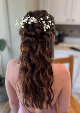 Brown bridal hair style, curls with white gyp flower headpiece