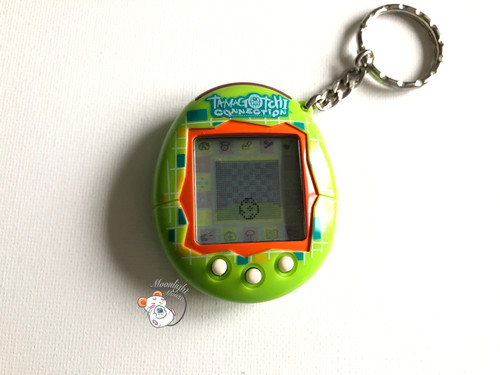 Tamagotchi Connection v1 English Green Blocks Shell 2004