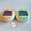 Thumbnail: Tamagotchi Original Osutchi Mesutchi Green Orange Stars Pair 1997