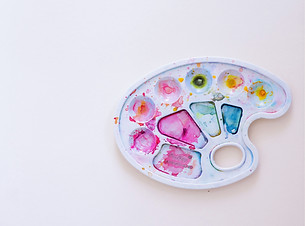 white pink and green round plastic toy_edited.jpg