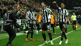 Newcastle United players celebrate late goal against Manchester United