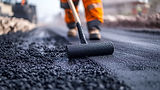 vecteezy_close-up-of-a-roller-applying-fresh-asphalt_50625368.jpeg