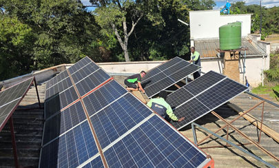Solar panels on top of a roof in Zimbabwe.