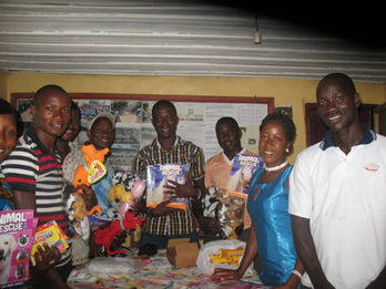 Animal rescue and protection organization in Liberia holds humane education material that was donated by Animal Kind International.