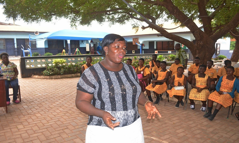 Madam Bernice of Kwabenya, M/A 5 Humane Education teacher, addresses the gathering