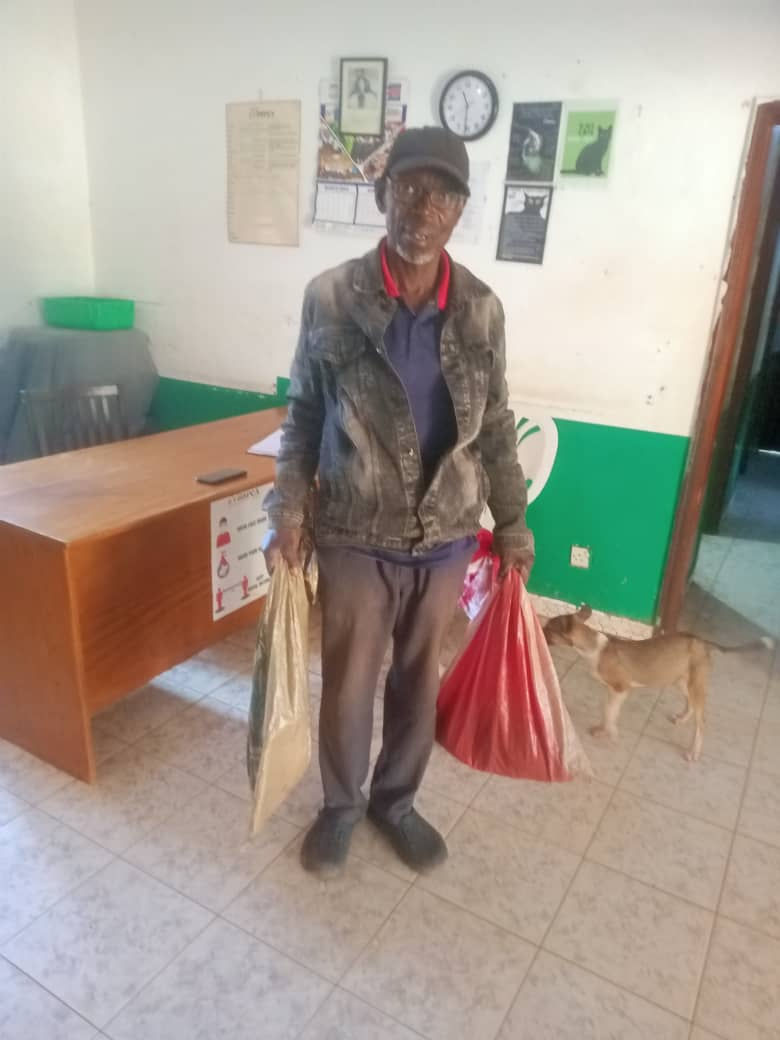 carrying cats in plastic bags to turn over to the USPCA shelter