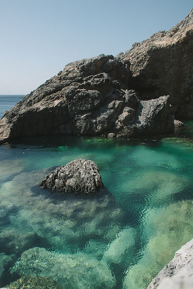 crystal clear waters and rocky cliffs 