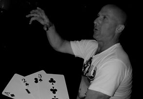 Kevin shows his hand while performing an unusually large card trick as part of his comedic magician routine at a private Vancouver Island / Courtenay, BC function.