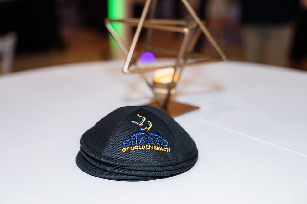 Elegant Kosher Catering branded cap and drink on a villa table — part of vacation catering service in Florida