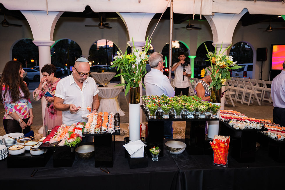 Bartender pouring drinks at a glatt kosher event with modern cocktail setup in Florida