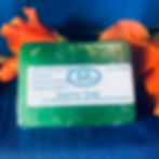Bar of green soap with a white label on it that says Jasmine Soap and Casaroma Logo