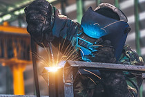 welder-is-welding-metal-part-car-factory.jpg