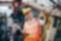 woman-in-a-hardhat-holding-a-laptop-data-6940894.jpg