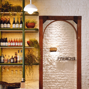 HW Homeworks textured wall with door frame and glass bottles