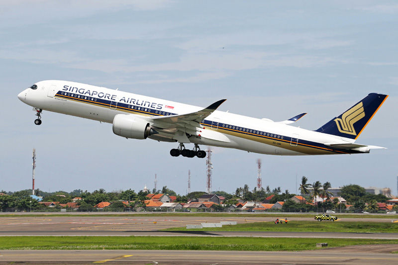 Airplane Taking off and Houses in Background