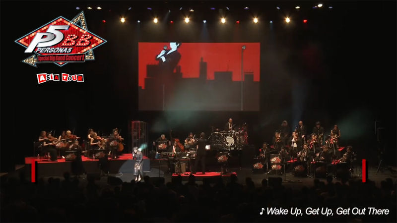 Orchestra performing on stage with a conductor, cityscape backdrop. "P5 Persona Special Big Band Concert Asia Tour" logo and song lyrics displayed.