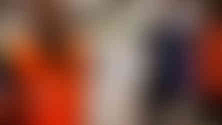 supermarket personnel holding signage