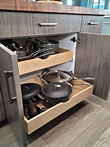 Roll-out shelves to help retreive pots and pans in this transitional kitchen remodel