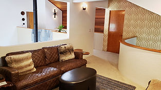 The grasscloth wallpaper continued up from the entryway and into this second story contemporary loft