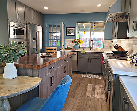 This blue and gray kitchen remodel has wide pathways and a large island for multiple people