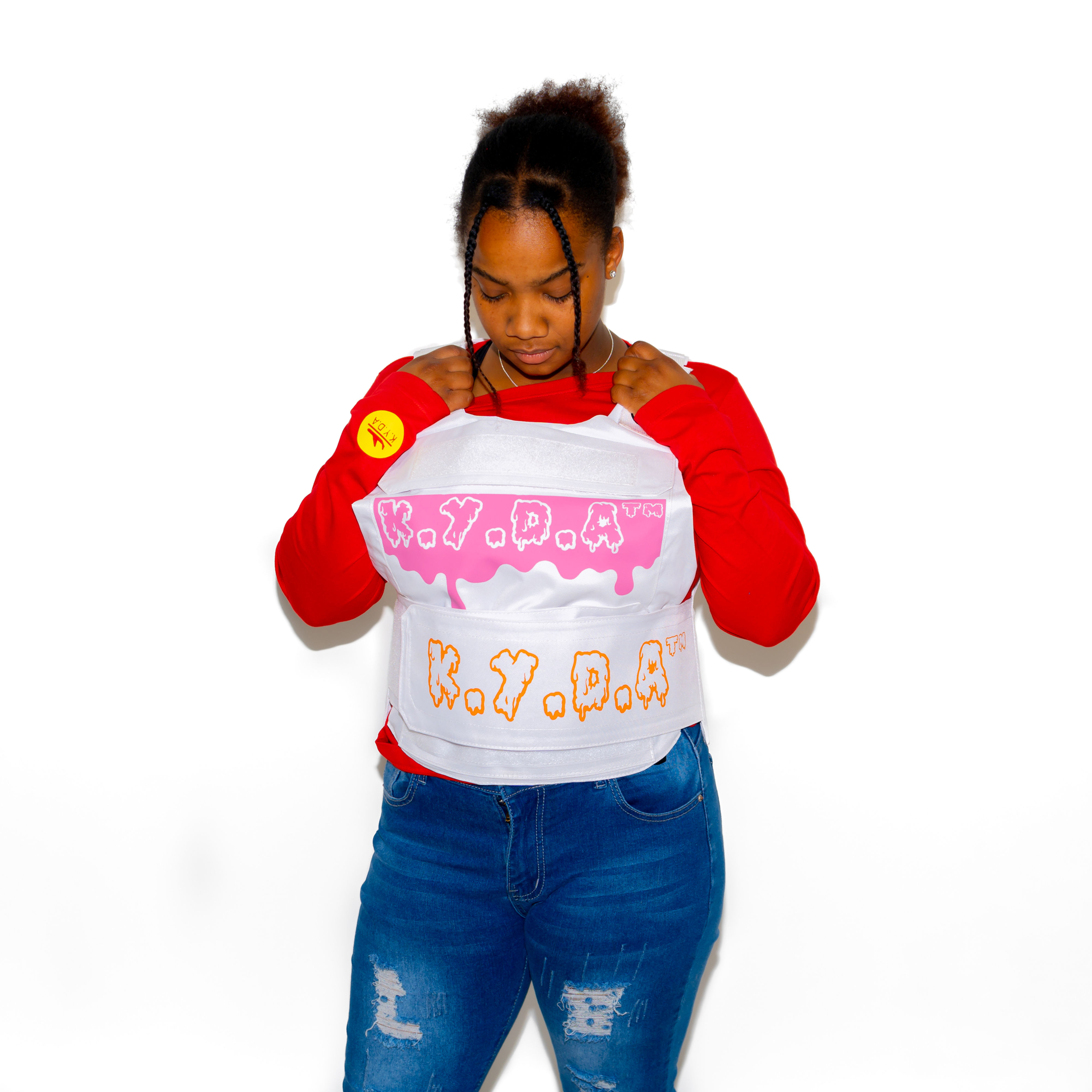 Model Wearing White Fashion Vest with Pink and Orange "K.Y.D.A SLIME" Design