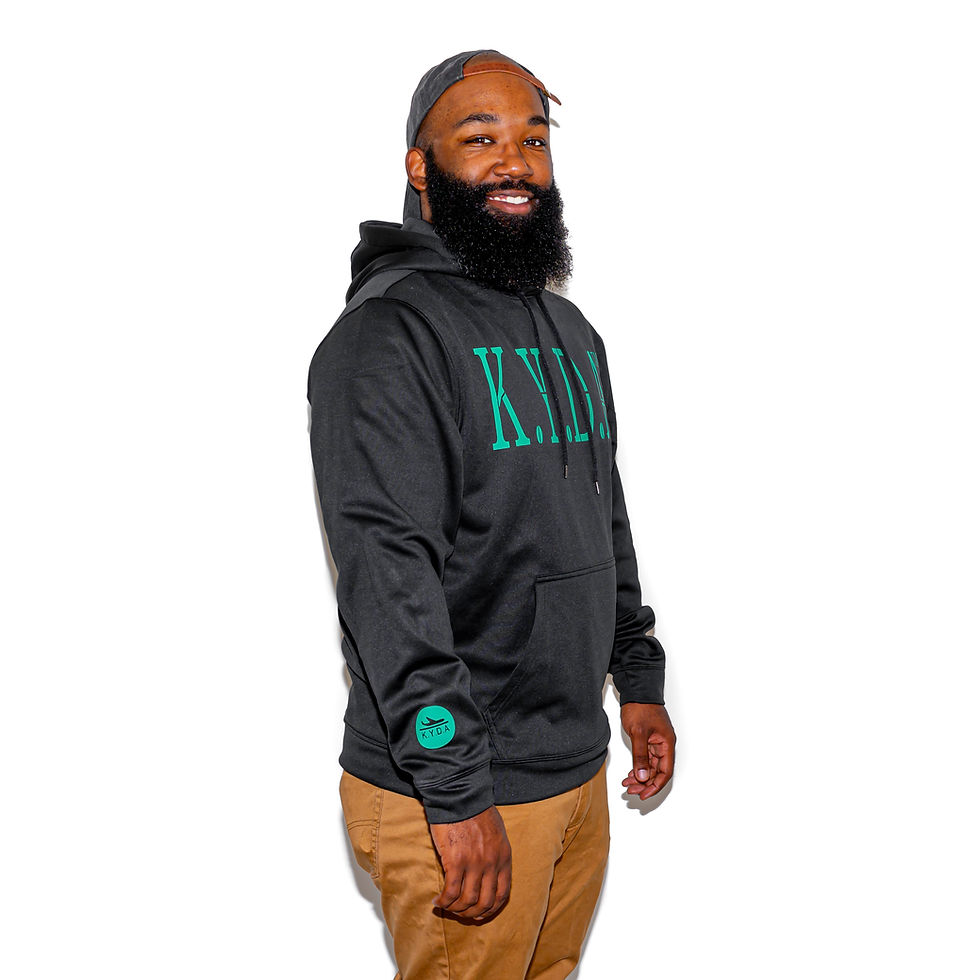 Model Wearing Black Hoodie with Green "K.Y.D.A BLOCKED" Design