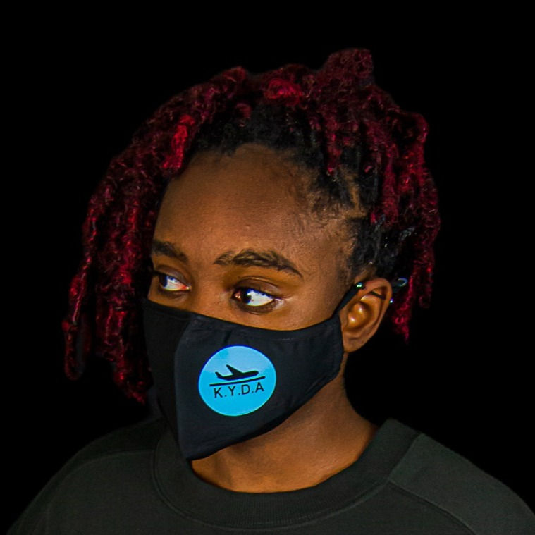 Model Wearing Black FaceMask with Blue "Masked Up" Design