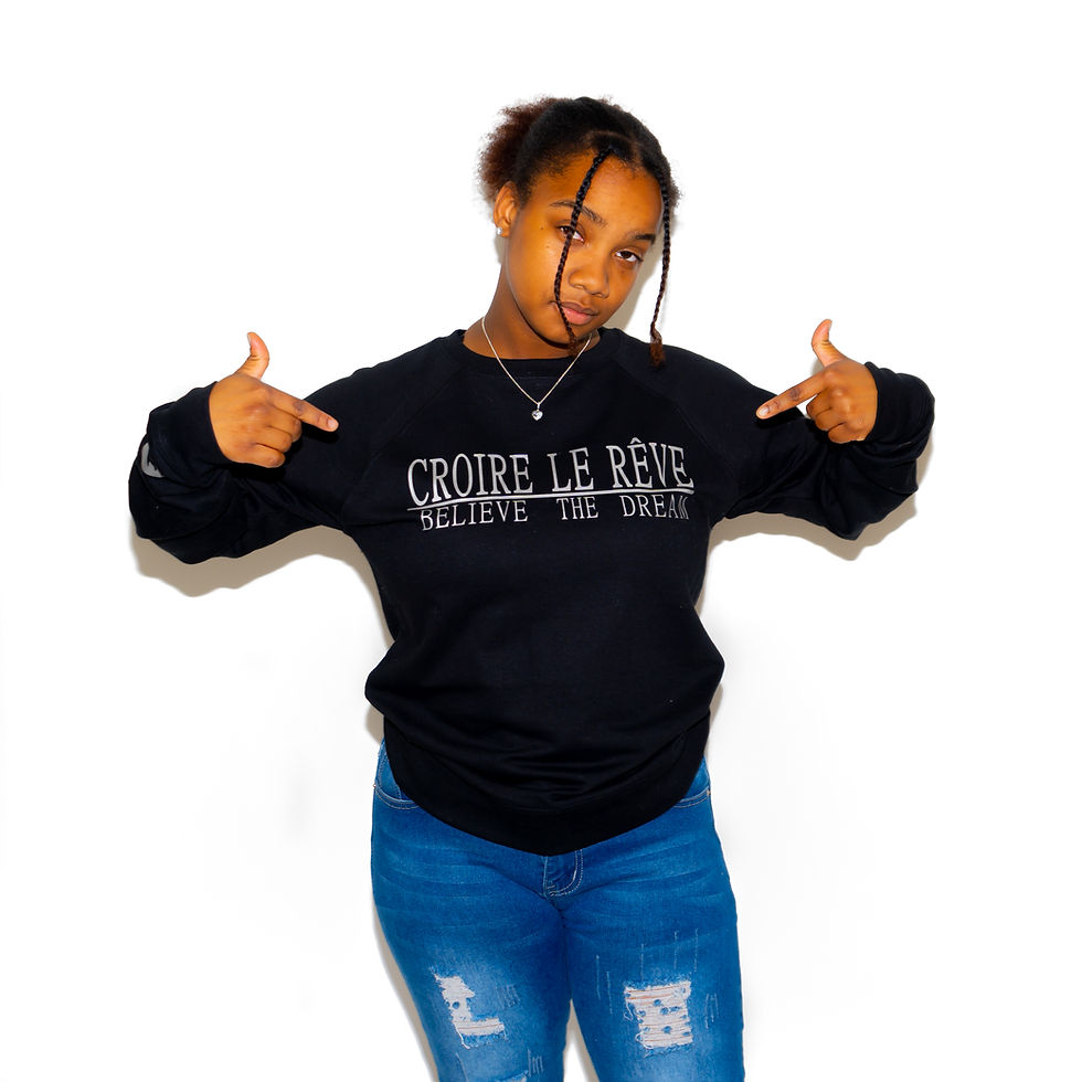 Model Wearing Black Crewneck Sweater with Silver "CROIRE LE REVE" Design