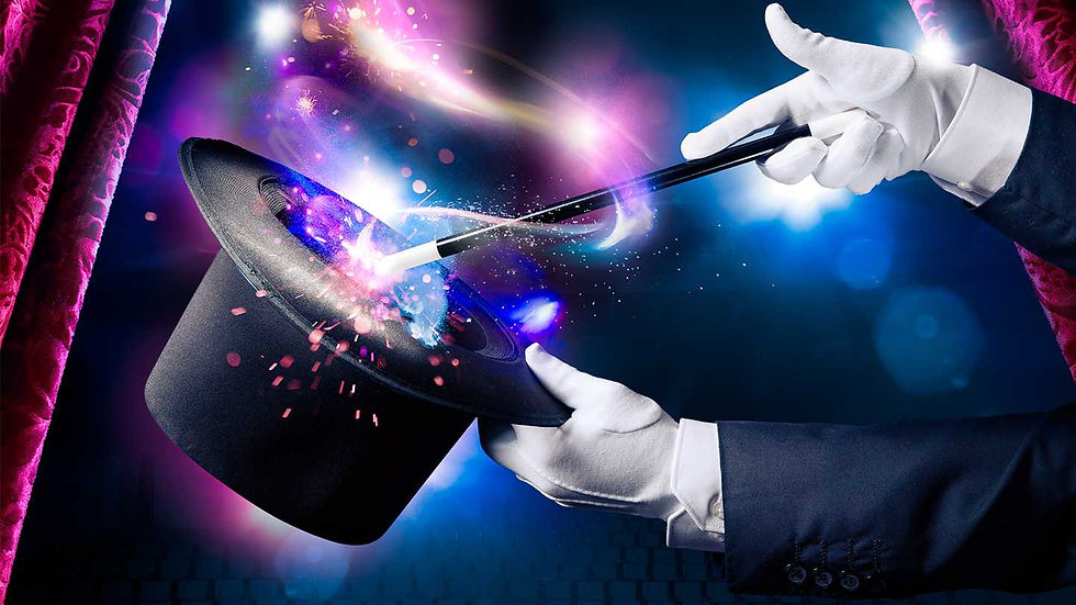 Magician's hands with hat and wand performing a trick