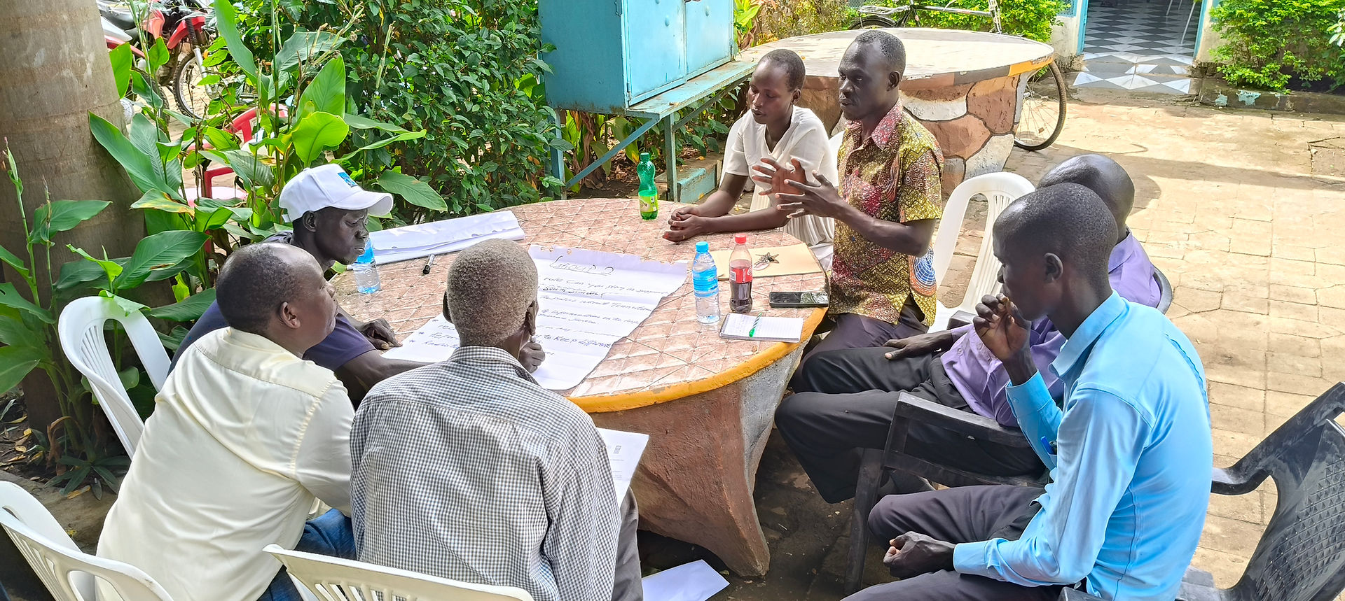 Participants sharing ideas at a Training of Trainers event in Torit in July 2025