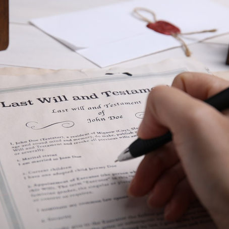 A person signing a will.