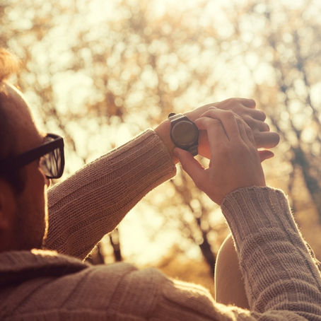 A man checking his watch. 