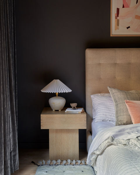 Moody bedroom design with velvet accents.