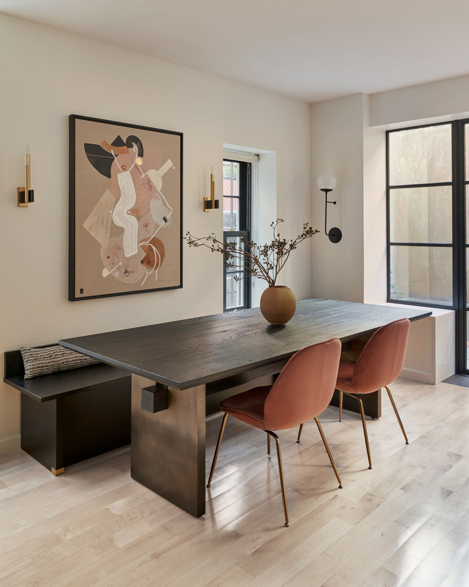 Black and white dining room design with painting featured.