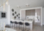 Modern Kitchen Grey Cabinets Black Barstools Black and White Art
