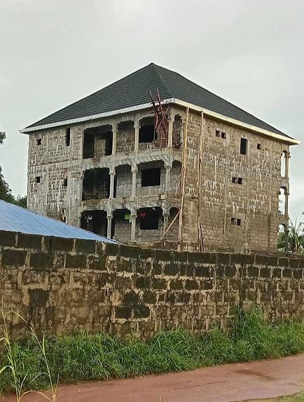 Side view of hospital showing roof completion