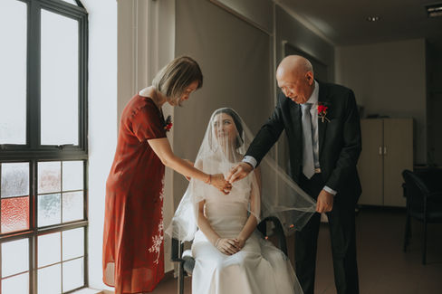 Actual day wedding photoshoot at Bethel Presbytherian Church in Singapore, featuring a couple attending their marital church service surrounded by friends and family. Photographed by Bridelope Productions.